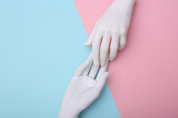 The mannequin's white hands touch each other on pink blue background. Minimalism. Concept art