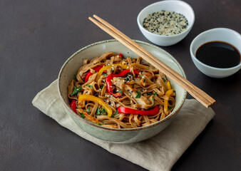 Noodles with pork, pepper and soy sauce. Asian food. Wok.