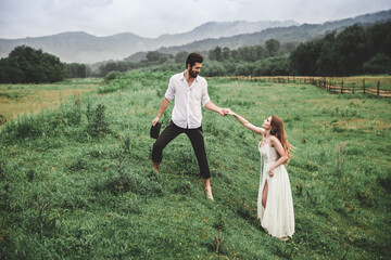 Beautiful young couple. Wedding photo session outdoors in the mountains. Happy couple. New family.