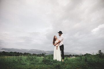 Beautiful young couple. Wedding photo session outdoors in the mountains. Happy couple. New family.