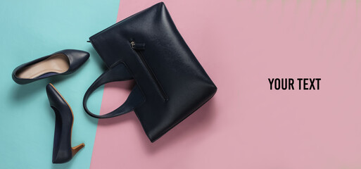 Classic high heel shoes, leather bag on a blue-pink pastel background. Copy space. Minimalism fashion concept. Top view