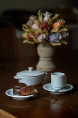 Uruguayan and Argentinian alfajor in dark scenery. Typical South American food. Chocolate cake with dulce de leche filling. Uruguay. Argentina