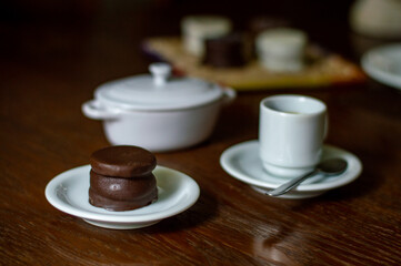 Uruguayan and Argentinian alfajor in dark scenery. Typical South American food. Chocolate cake with dulce de leche filling. Uruguay. Argentina