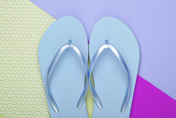 Flip flops on colored pastel background. Top view