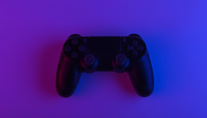 Gamepad with neon purple blue light. Gaming concept.