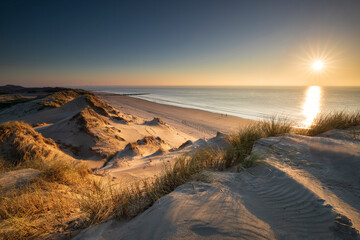 view on sea sunset from top of dune