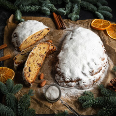 Christmas stollen on wooden background. Traditional Christmas festive pastry dessert. Stollen for Christmas.