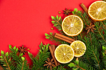 Fototapeta na wymiar Christmas composition with fir branches, dried orange slices and spices