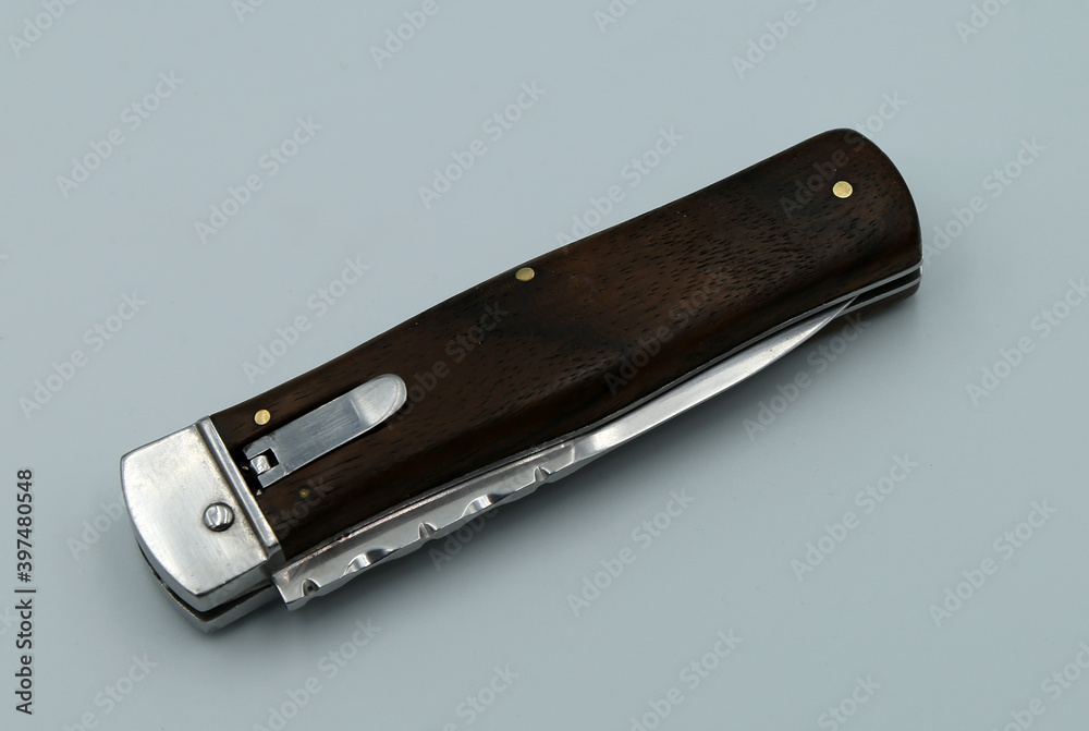 Poster folding knife on gray background