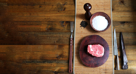 Ancho. Steak bbq in wooden background