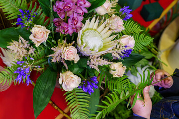 entrepreneur woman working in the flower shop after being able to reopen