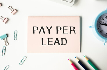 PAY PER LEAD text concept write on notebook. business concept