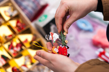 Beautiful second hand decorations for the Christmas tree in female hands