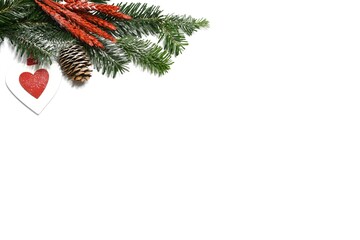 Christmas background with fir branch, pinecones and ornaments on white background.