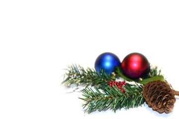 Christmas balls, fir branches and pine cones with ornaments isolated on white background.