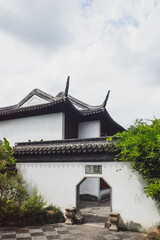 Traditional Chinese house and octagonal gate on Tiger Hill (Huqiu), Suzhou, Jiangsu, China
