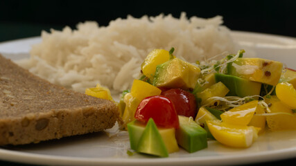 portion of rice with salad and a slice of bread, healthy food