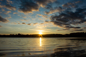 Obraz premium sunset over the river