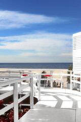 Outside Modern Exterior With Sea View From Wight Balcony Or Terrace. Hotel Or Private House Or Apartment Terrace With Seascape View. Beach Resort Alfresco Cafe Or Bar.