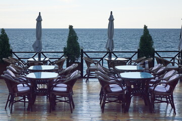 Seaview Restaurant Summer Terrace. Alfresco Sea Front Cafe With Wicker Rattan Furniture. Empty...