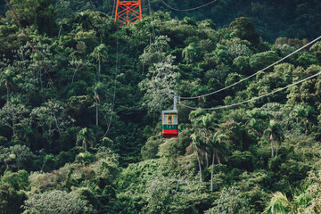 Cable car on a cableway (teleferico) over the green mountain in Puerto Plata, Dominican Republic 