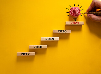2021 new year symbol. Wooden blocks with numbers '2017, 2018, 2019, 2020, 2021'. Beautiful yellow...
