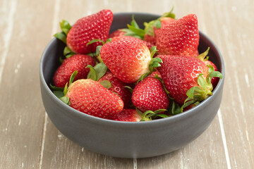 Closeup shot of sweet and ripe strawberries on a blurred background