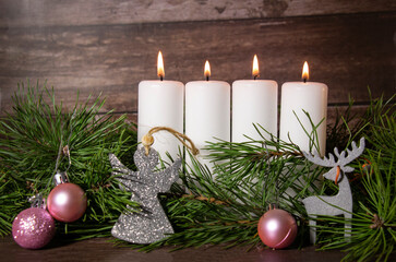 Fototapeta na wymiar Advent wreath for christmas, four burning white candles