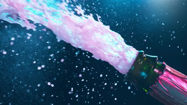 Super slow motion of Champagne explosion with flying cork closure, opening champagne bottle closeup.