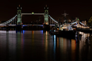 Fototapeta na wymiar HMS Belfast floating on the river Thames next to Tower Bridge