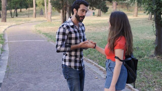 jealousy, betrayal-young man justifies himself with his girlfriend slapping him