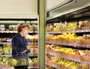 Supermarket shopping, face mask and gloves,man buying fruits at the market.