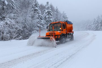 It's winter time. The mountain road is snowy and slippery. The snow plow clears the way. Uludag...