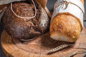 Various rustic bread on a wooden board. Healthy food and farming concept