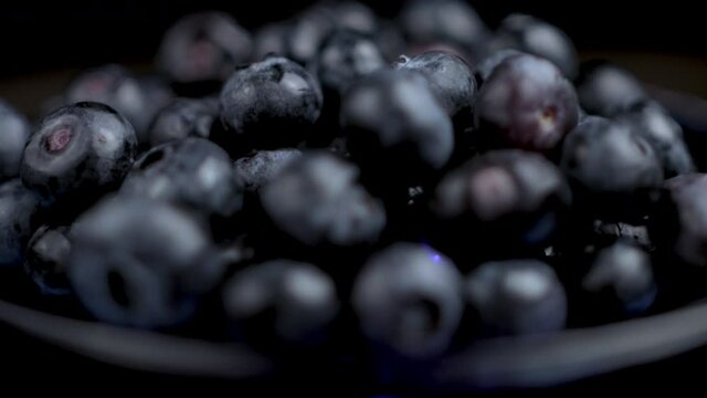 Bluberries Close Up. Fresh Blue Berries Spinning on Plate, Macro With Selective Focus, Full Frame