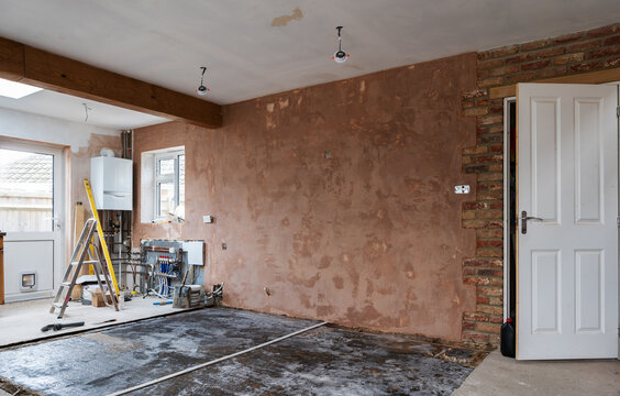 Home extension renovation project, plastering of the walls, smooth brown background, selective focus