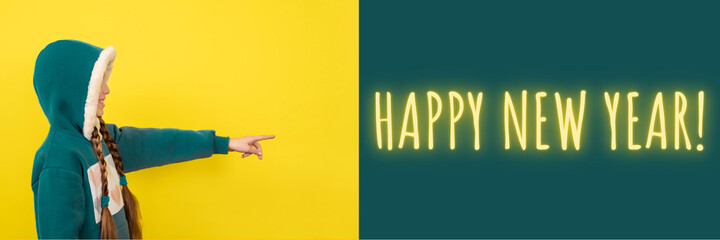 Teen beautiful girl pointing her finger on happy new year. Banner with copy space