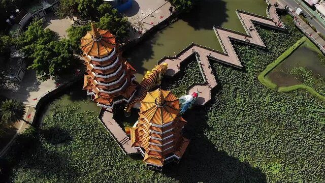 Aerial drone view over Pagodas at Lotus Pond Lake in Kaohsiung city, Taiwan.
Low angle, parallax movement, HD.