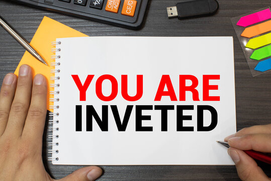paper with text YOU ARE INVETED. Business concept