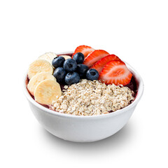 Brazilian frozen açai berry ice cream bowl with strawberries, bananas, blueberry and granola. isolated on a white background. Summer menu front view