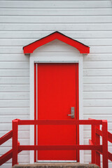 red wooden door with roof