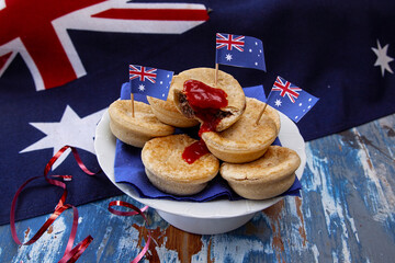 A plate of traditional meat pies with tomato sauce. © Inge