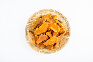 Dried sweet potatoes in a pot on white background