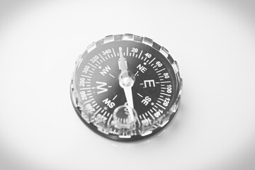 compass on a turquoise background