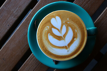 cup of hot latte art coffee