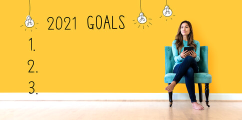 2021 goals with young woman holding a tablet computer