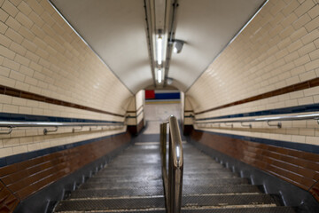 empty stairs with blured background in a subway tube station in London
