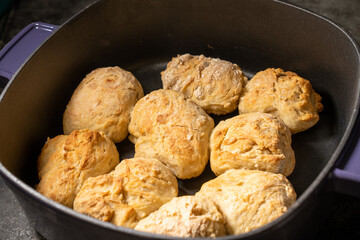 Closeup of fresh biscuits in a Dutch oven. High quality photo taken at the peak of freshness