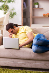 Fototapeta premium Young man student freelancer in teleworking concept