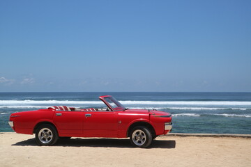 Fototapeta na wymiar car red beach